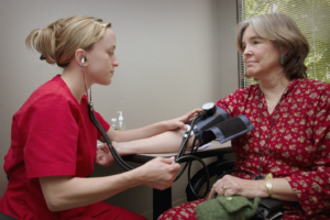 Chronic Disease Specialist Checking Patient’s Blood Pressure